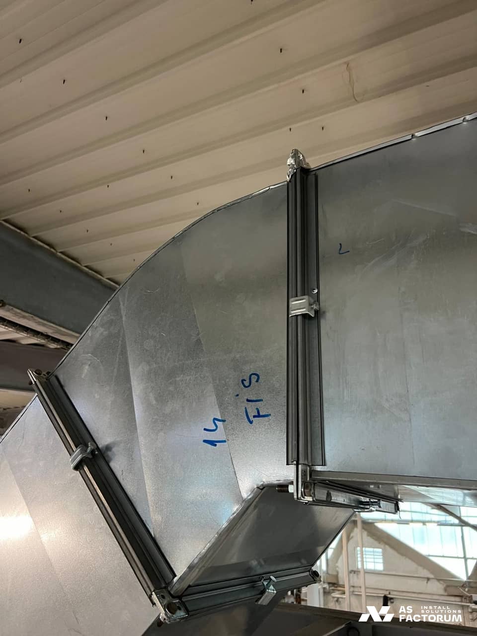 Galvanised rectangular duct elbow with flanges and handwritten markings